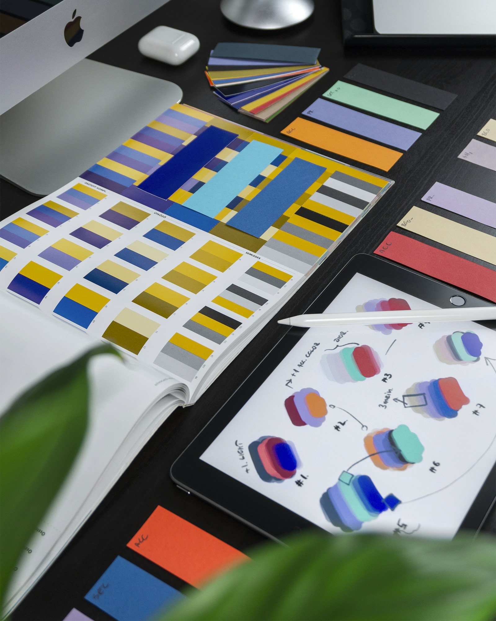Art director reviewing reference images at a studio desk in Toronto